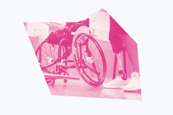White and pink graphic of a wheelchair and a person's prosthetic leg.