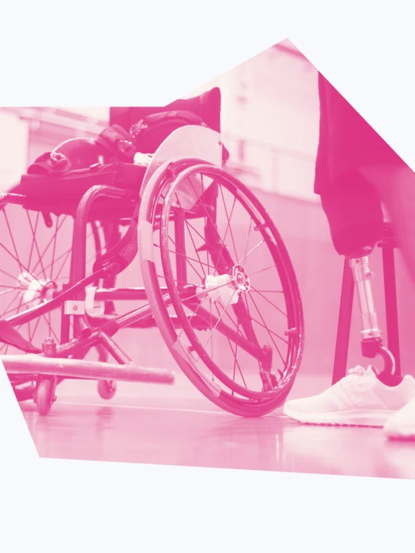 White and pink graphic of a wheelchair and a person's prosthetic leg.