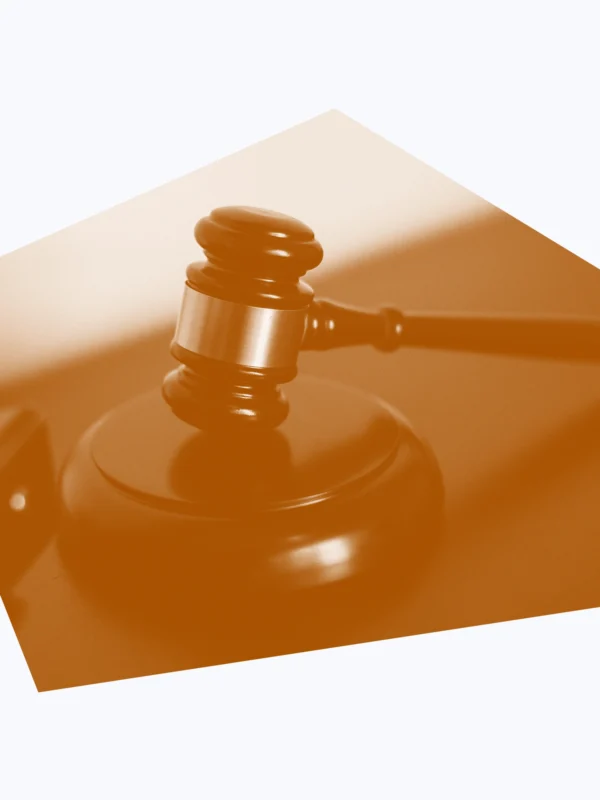 White and dark orange graphic of a gavel on a desk