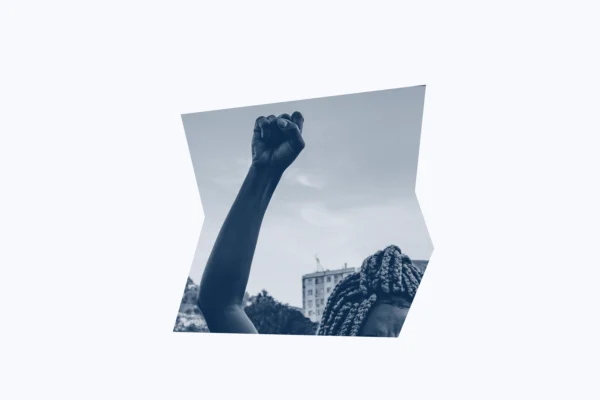 Dark blue and white graphic of a person with their fist raised.