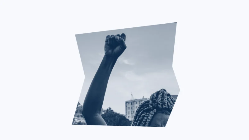Dark blue and white graphic of a person with their fist raised.