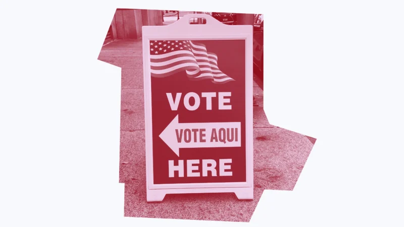 Dark red graphic of a "vote here/vote aqui" sign.