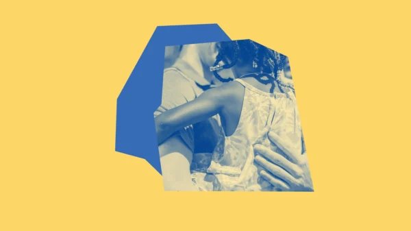 Yellow and blue graphic with an adult holding a young child.