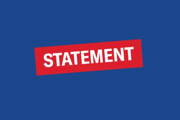 Dark blue graphic with red and white "statement" text.