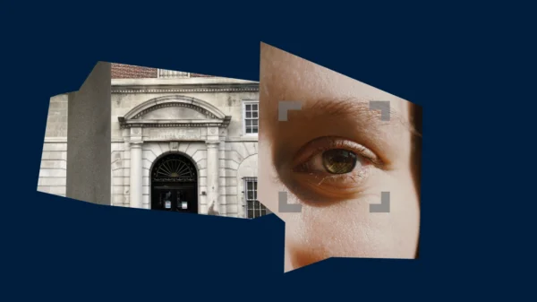 Dark blue background with an image of a Providence courthouse and a photo of a person's eye.