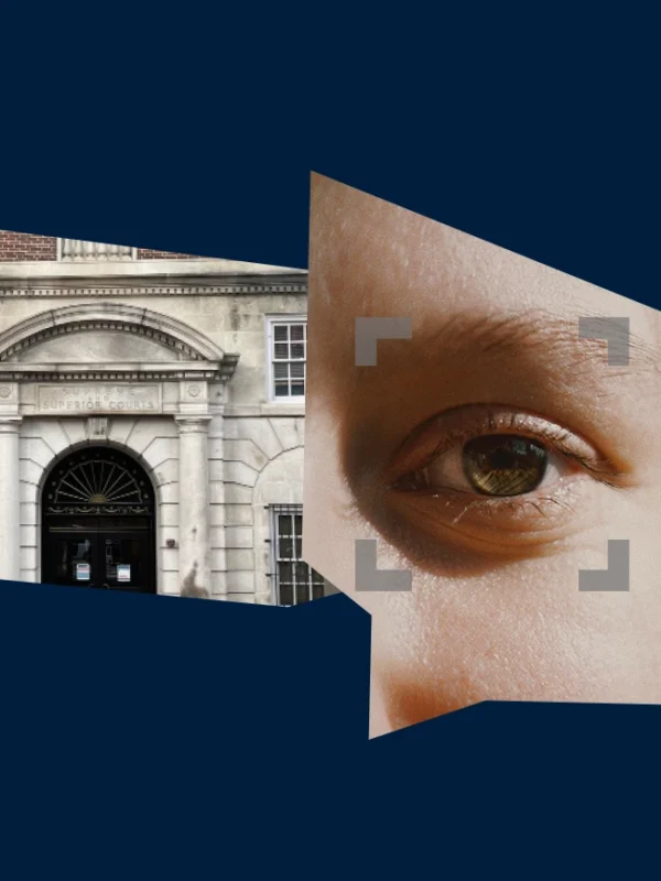 Dark blue background with an image of a Providence courthouse and a photo of a person's eye.